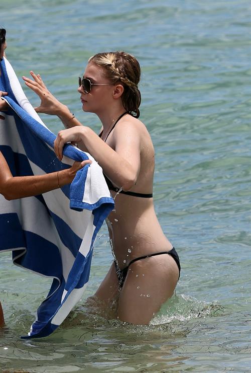 Chloe Grace Moretz candids in a Black Bikini in Miami Beach