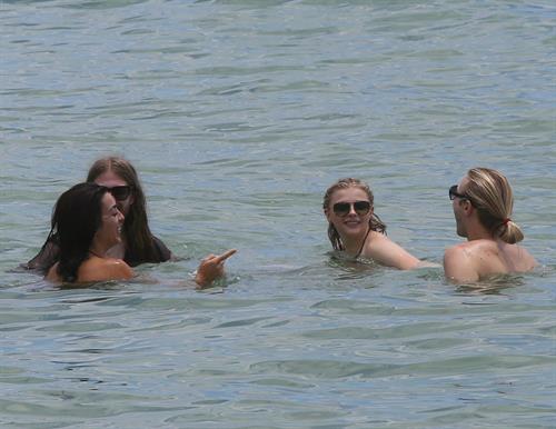 Chloe Grace Moretz candids in a Black Bikini in Miami Beach