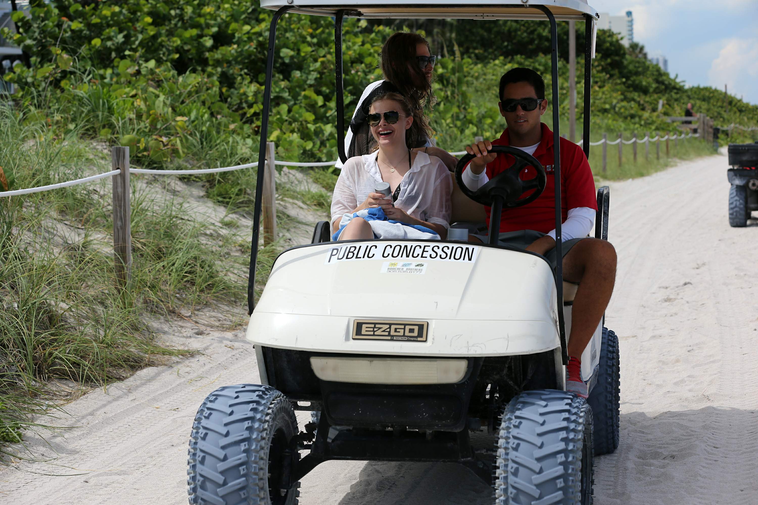 Chloe Grace Moretz candids in a Black Bikini in Miami Beach