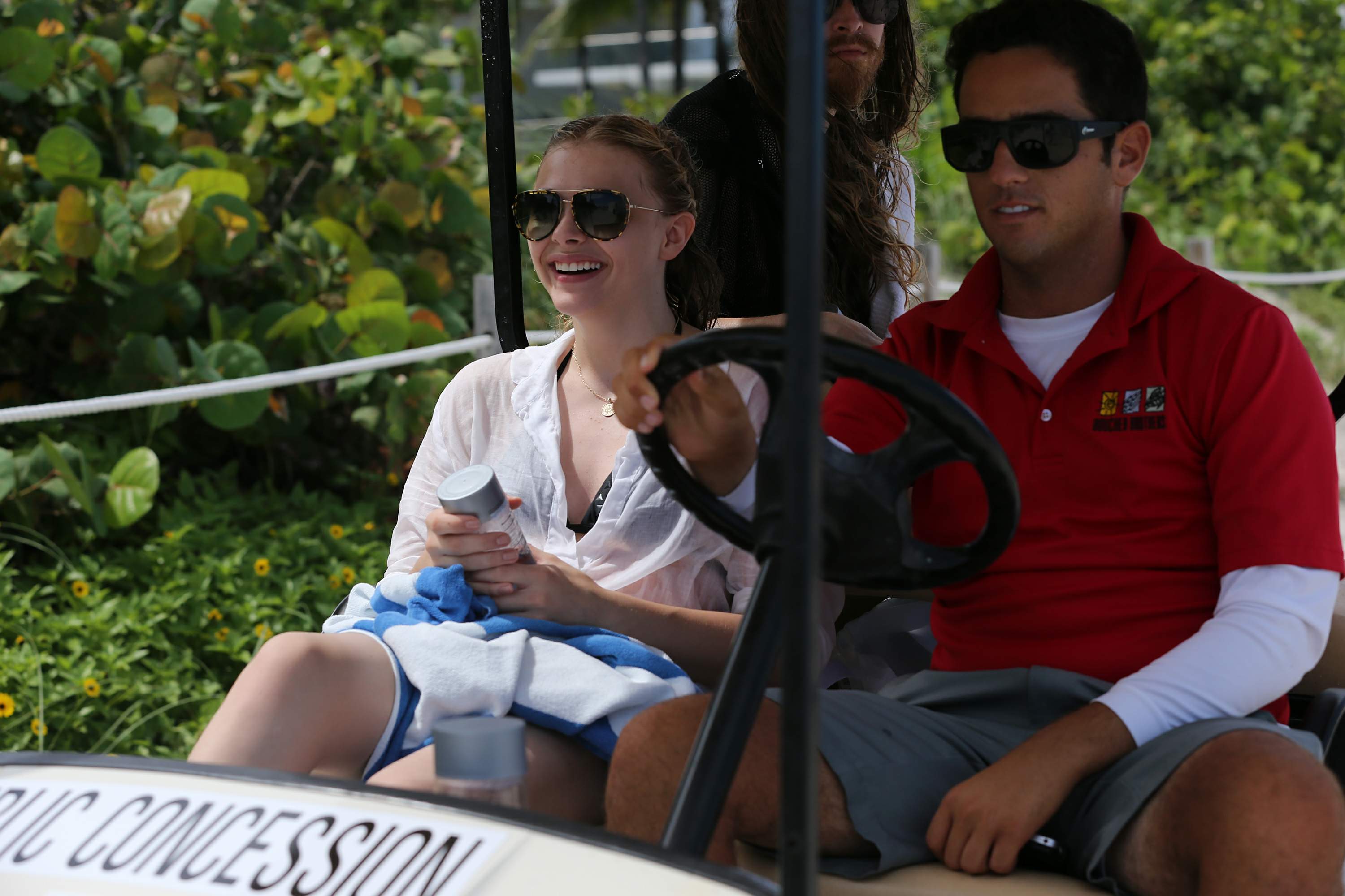 Chloe Grace Moretz candids in a Black Bikini in Miami Beach