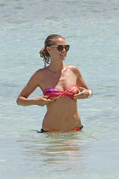 Heidi Klum wearing a bikini on a beach in the Bahamas on July 6, 2013