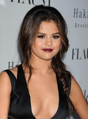Selena Gomez showing off a ton of cleavage at Flaunt Magazine Release Party in Beverly Hills - Los Angeles - November 7, 2013 