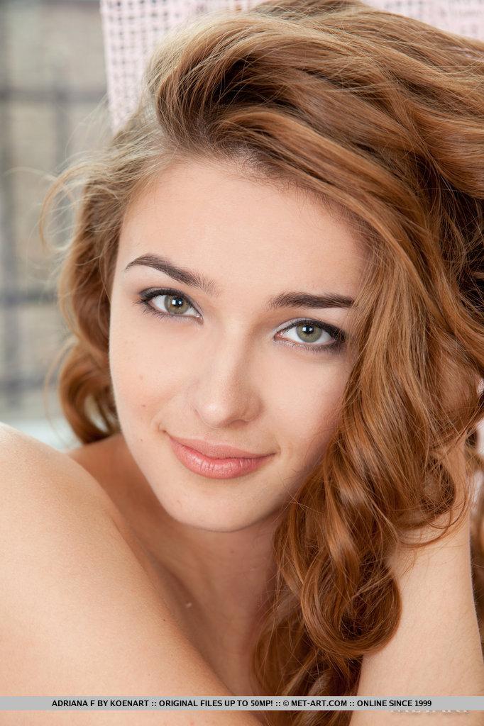 Adriana F poses on fur rug