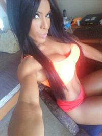 Yarishna Ayala Otero in a bikini taking a selfie