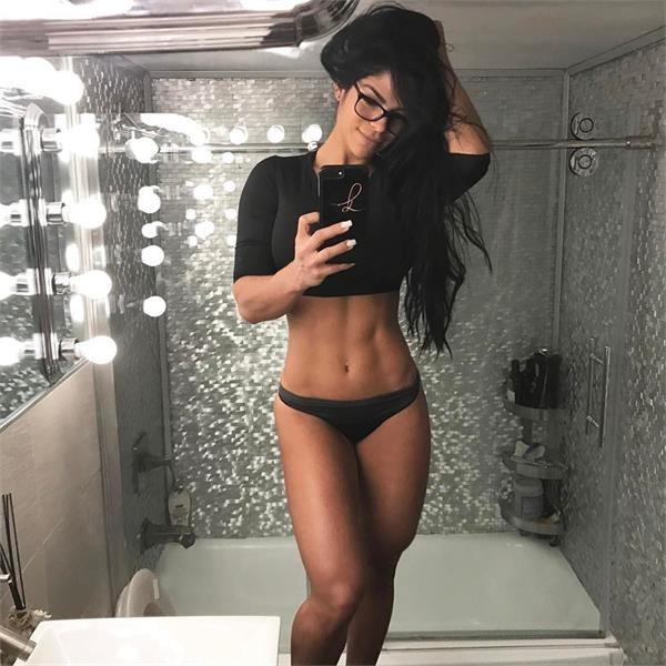 Michelle Lewin in a bikini taking a selfie