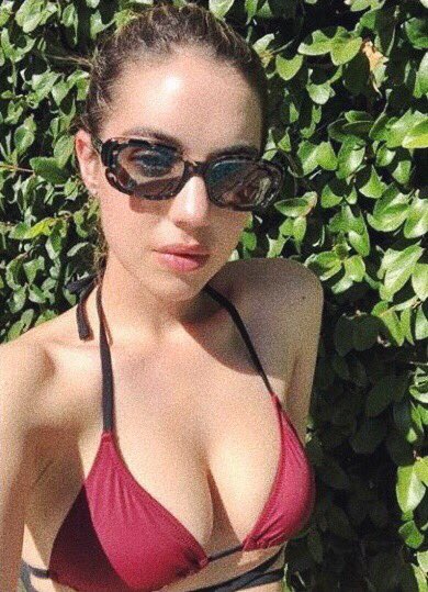 Adelaide Kane in a bikini taking a selfie