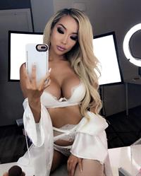 Arika Sato in lingerie taking a selfie