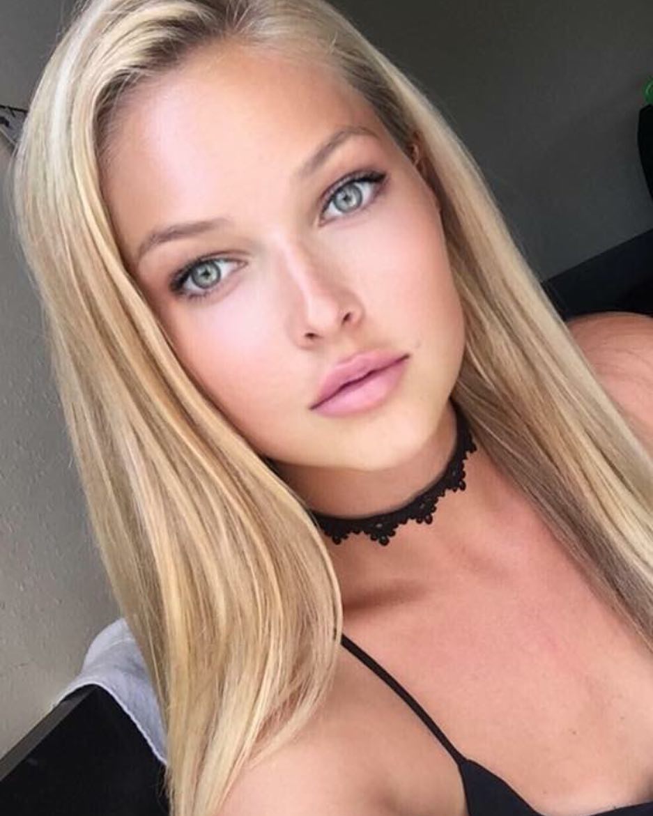 Ashley Smouter in a bikini taking a selfie