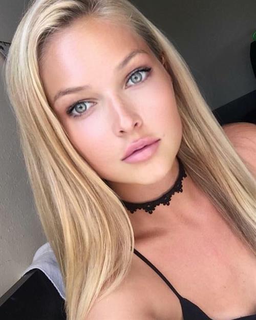 Ashley Smouter in a bikini taking a selfie