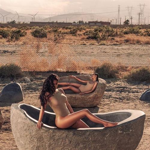 Kim Kardashian Pictures Kim Kardashian sexy new photos in a nude bodysuit.