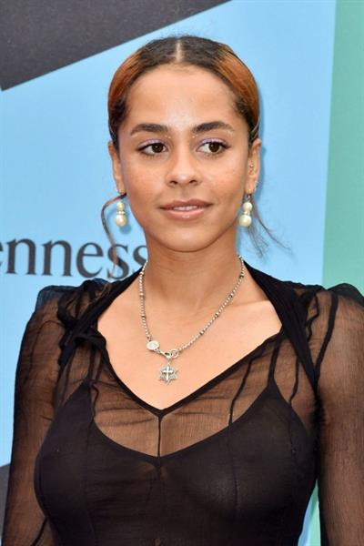 Olive Gray boobs in a see through dress clearly showing her tits.







