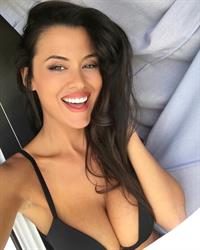 Eva Padlock in a bikini taking a selfie