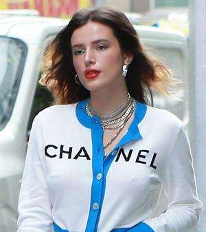Bella Thorne braless tits seen by paparazzi showing her pierced nipple dressed all in Chanel.






