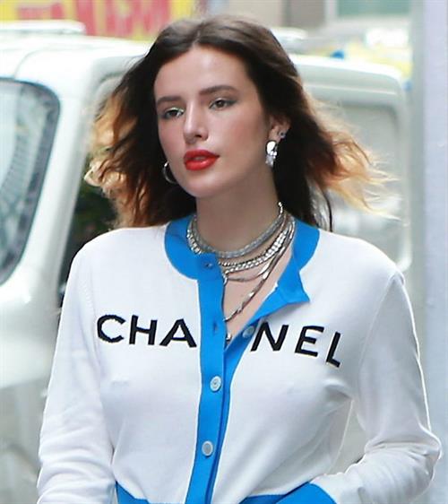 Bella Thorne Pictures Bella Thorne braless tits seen by paparazzi showing her pierced nipple dressed all in Chanel.