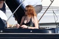 Lindsay Lohan showing nice cleavage with her big boobs in a Gucci swimsuit seen by paparazzi.





















