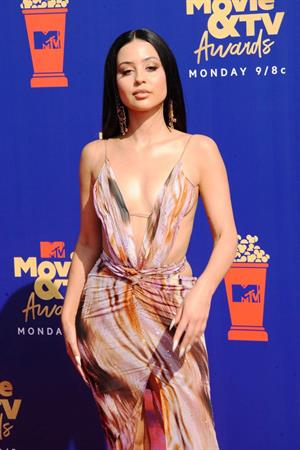 Alexa Demie braless boobs in a revealing dress on the red carpet at the 2019 MTV Movie and TV Awards.






















