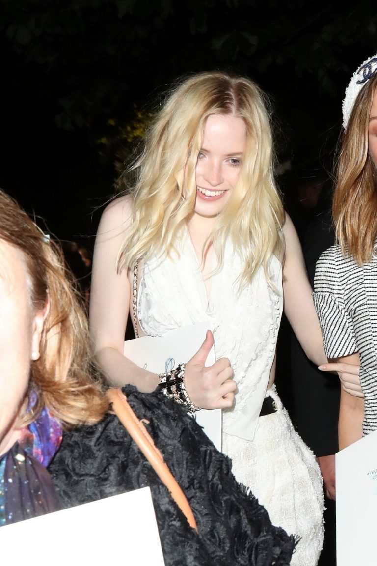 Ellie Bamber braless boobs while wearing basically a scarf as a top showing side  boob cleavage. 8.72/10