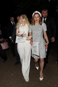 Ellie Bamber braless boobs while wearing basically a scarf as a top showing side boob cleavage.








