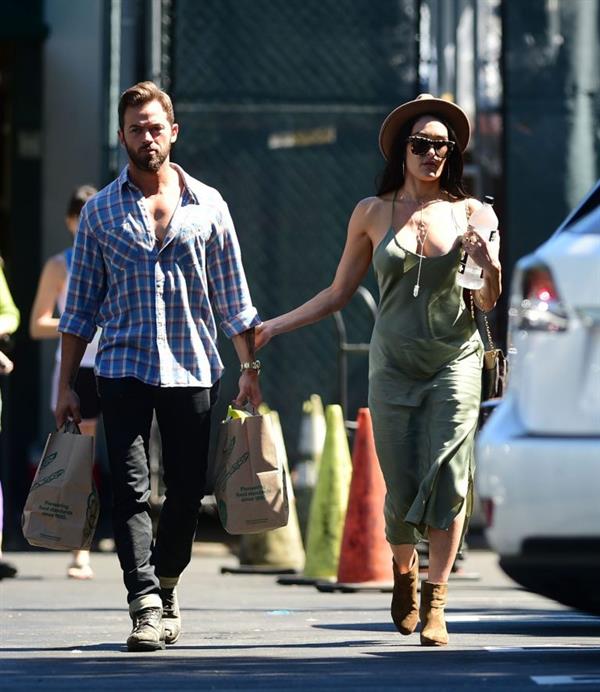 Nikki Bella braless boobs in a green dress seen by paparazzi.
















