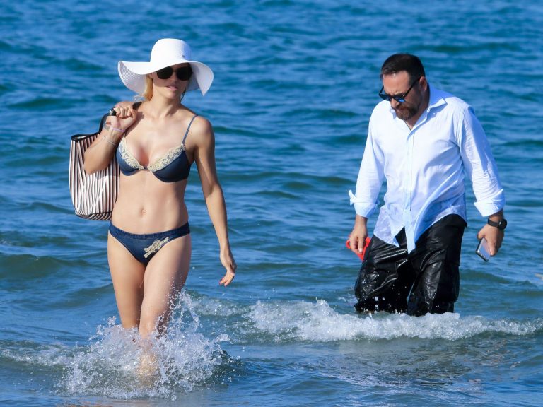 Michelle Hunziker Bikini Pictures Michelle Hunziker sexy ass bikini body seen by paparazzi at the beach showing nice cleavage.