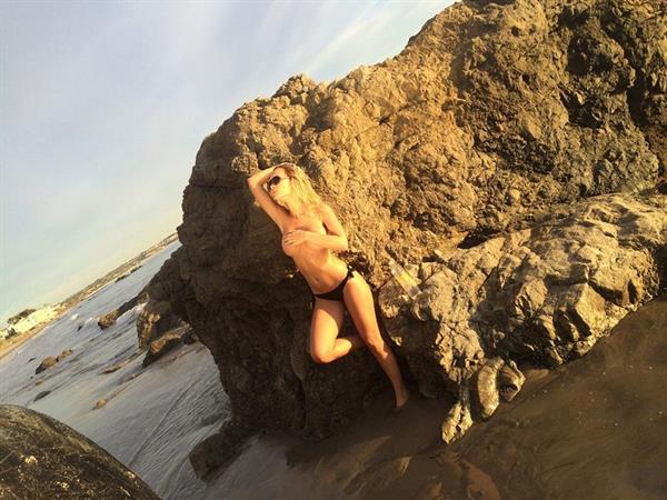 Ella Rose in a topless beach photoshoot