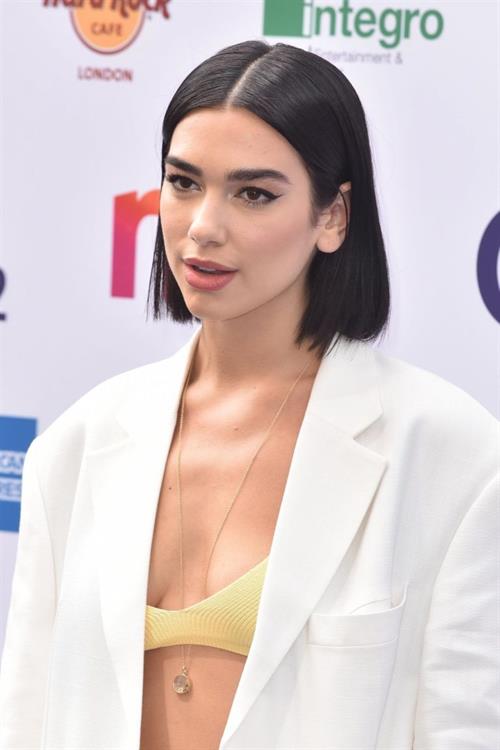 Dua Lipa Pictures Dua Lipa looking hot in a sexy revealing top seen by paparazzi.