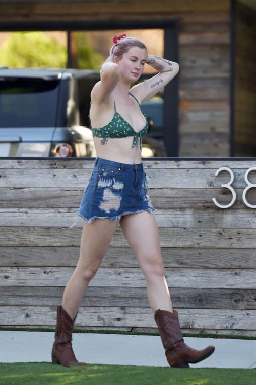 Ireland Baldwin Pictures Ireland Baldwin sexy in a bikini top seen by paparazzi showing some nice cleavage.