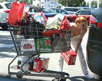 Ariel Winter areola peek in a sexy bikini top seen by paparazzi buying liquor.









