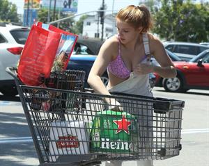 Ariel Winter areola peek in a sexy bikini top seen by paparazzi buying liquor.









