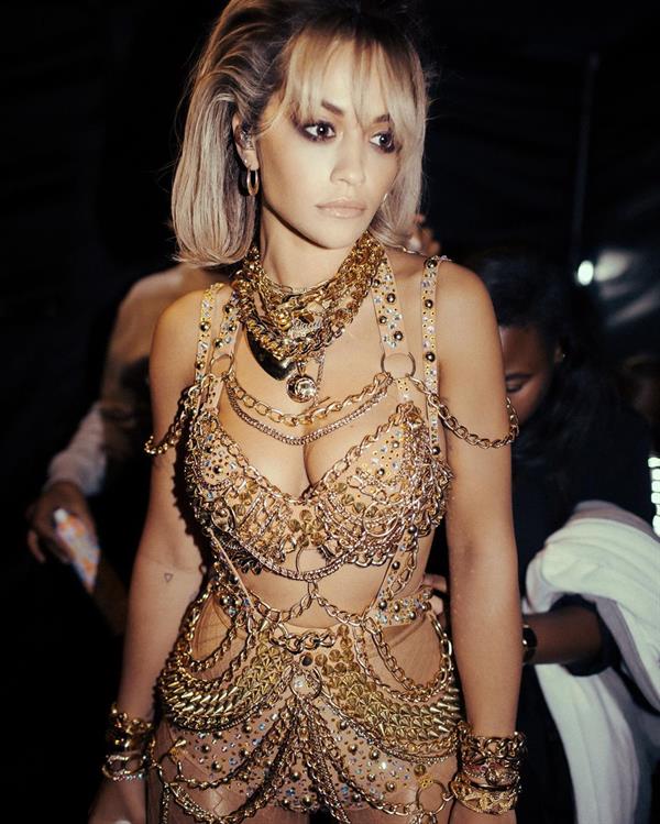 Rita Ora sexy see through outfit on stage.













