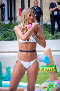 Arabella Chi in a sexy thong bikini showing off her perfect body seen by paparazzi.
























