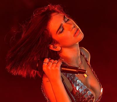 Dua Lipa showing some nice cleavage.


























