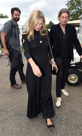 Kate Moss braless tits pokies in a black dress seen by paparazzi.



























