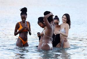 Kendall Jenner sexy ass in a thong bikini seen by paparazzi in the water at the beach.




























