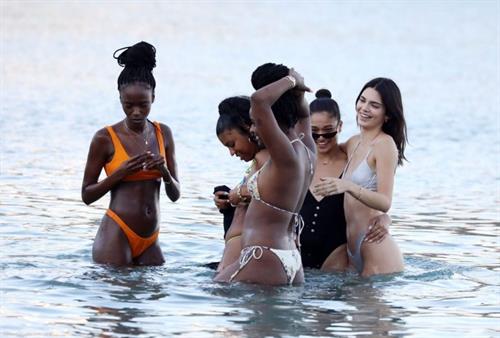 Kendall Jenner Bikini Pictures Kendall Jenner sexy ass in a thong bikini seen by paparazzi in the water at the beach.