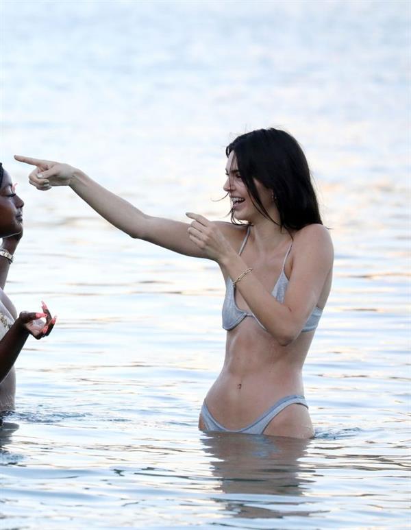 Kendall Jenner sexy ass in a thong bikini seen by paparazzi in the water at the beach.




























