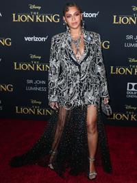 Beyonce braless boobs and areola peek showing off nice cleavage on the red carpet for the premiere of  The Lion King .






