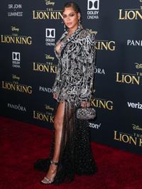 Beyoncé Knowles Pictures Beyonce braless boobs and areola peek showing off nice cleavage on the red carpet for the premiere of  The Lion King .