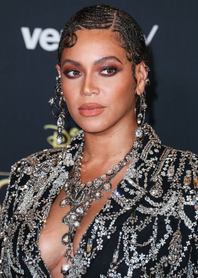 Beyonce braless boobs and areola peek showing off nice cleavage on the red carpet for the premiere of  The Lion King .







