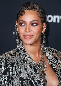 Beyonce braless boobs and areola peek showing off nice cleavage on the red carpet for the premiere of  The Lion King .






