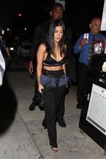 Kourtney Kardashian sexy cleavage in a black top seen by paparazzi.













