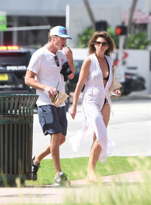 Cindy Crawford Pictures Supermodel Cindy Crawford in a sexy bikini showing nice cleavage seen by paparazzi.