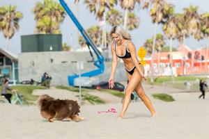 WWE Diva Lana or CJ Perry sexy boobs and ass in a bikini seen at the beach by paparazzi.











