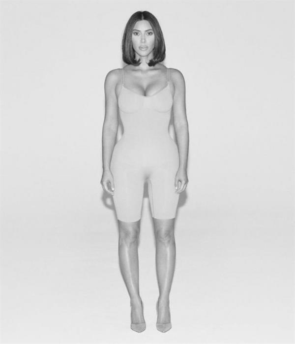 Kim Kardashian sexy new photo shoot for WSJ showing nice cleavage in her shape wear.






























