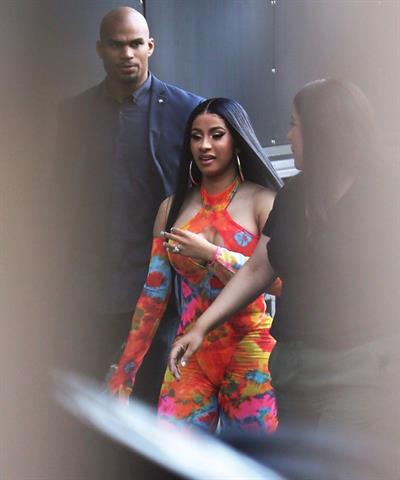 Cardi B boobs and booty on display on and off stage showing nice cleavage and her sexy ass in a tight dress.























