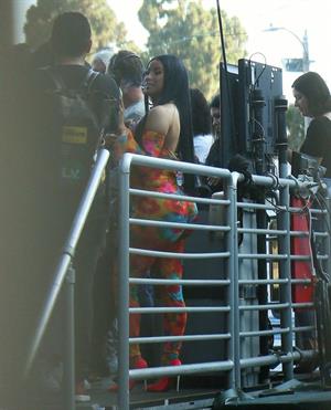 Cardi B boobs and booty on display on and off stage showing nice cleavage and her sexy ass in a tight dress.























