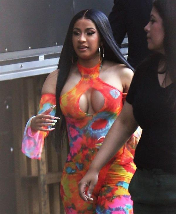 Cardi B boobs and booty on display on and off stage showing nice cleavage and her sexy ass in a tight dress.























