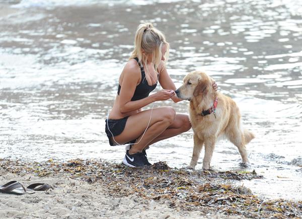 Kimberley Garner at the beach with her dog