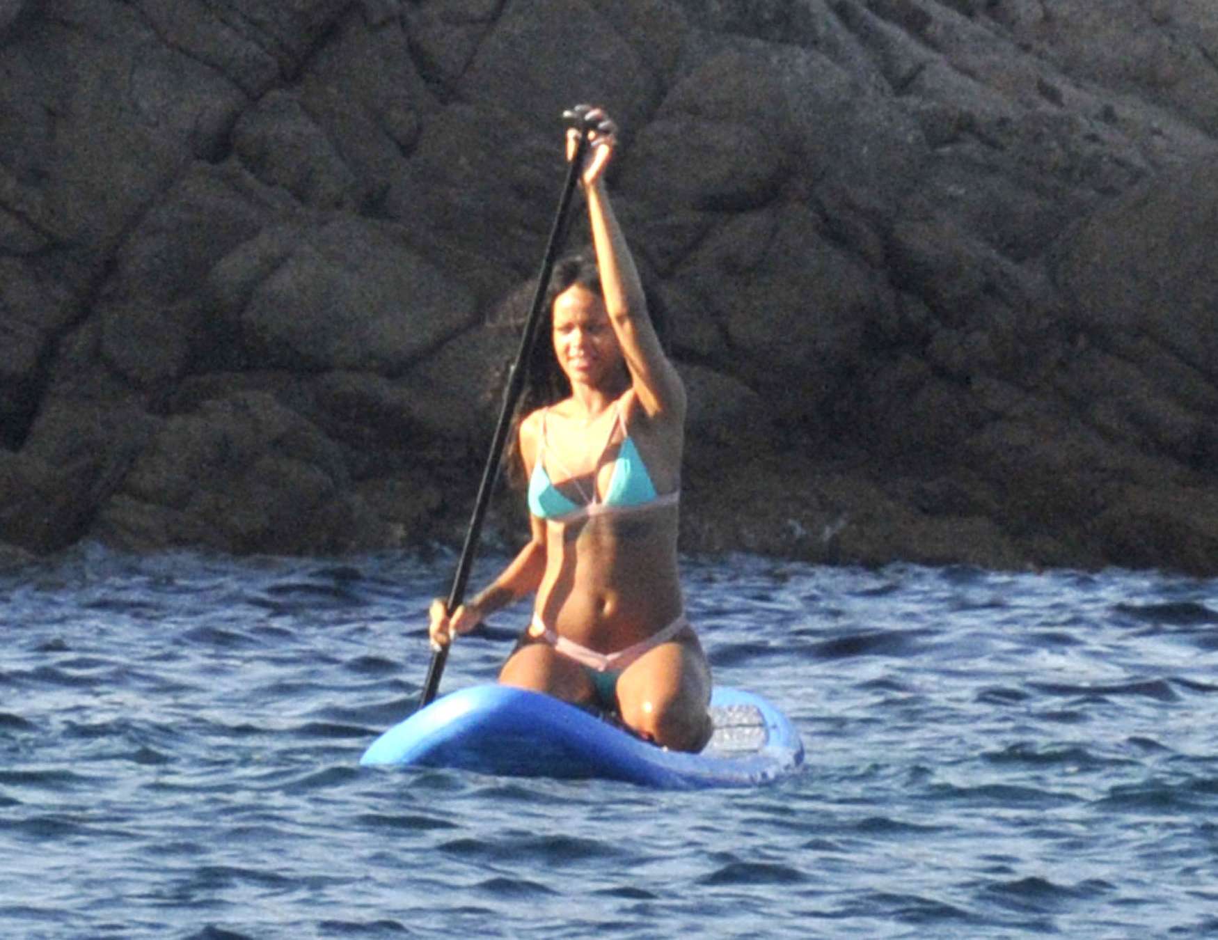 Rihanna paddle boarding