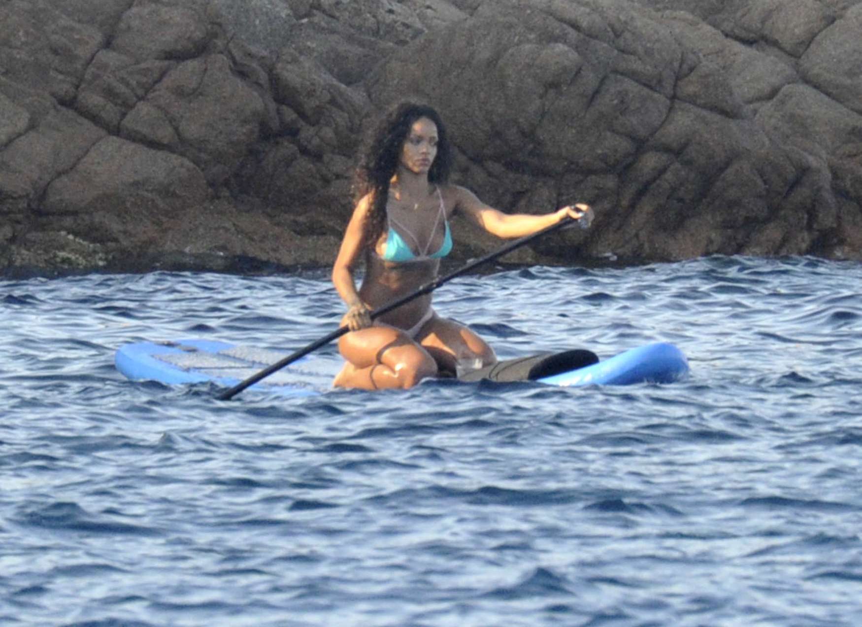Rihanna paddle boarding